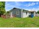 View of the backyard, deck, and blue exterior at 2704 Atlantic St, Durham, NC 27707
