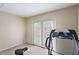 Bedroom featuring carpet floors, natural light, and access to the backyard at 2704 Atlantic St, Durham, NC 27707