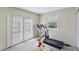 Bedroom featuring carpet floors, natural light, and access to the backyard at 2704 Atlantic St, Durham, NC 27707