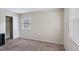 Neutral bedroom featuring a closet, carpet floors, and natural light from a window at 2704 Atlantic St, Durham, NC 27707