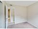 Neat bedroom bathed in natural light, connecting to the bathroom for added convenience at 2704 Atlantic St, Durham, NC 27707