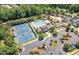 Aerial view of community amenities including tennis courts, pool, clubhouse, and parking at 3413 Fairstone Rd, Wake Forest, NC 27587