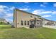 Well-maintained backyard with a lush lawn, a patio, and a screened porch for outdoor living at 3413 Fairstone Rd, Wake Forest, NC 27587