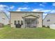 Large backyard featuring lush greenery, a grill, and a charming screened porch for relaxation at 3413 Fairstone Rd, Wake Forest, NC 27587