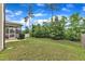 Expansive backyard with a mix of mature trees and lawn, offering privacy and space for activities at 3413 Fairstone Rd, Wake Forest, NC 27587