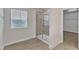 Bathroom with a glass door shower and a bright window letting in light at 3413 Fairstone Rd, Wake Forest, NC 27587