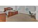 Spacious bedroom with neutral walls, a wooden bed, desk, and plenty of natural light at 3413 Fairstone Rd, Wake Forest, NC 27587