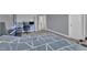 Well-lit bedroom features a modern design with a bed, desk, and neutral walls, offering a versatile living space at 3413 Fairstone Rd, Wake Forest, NC 27587