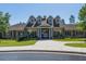 Community clubhouse featuring stone accents, well-manicured lawn, and covered entry at 3413 Fairstone Rd, Wake Forest, NC 27587