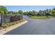 Stonegate Swim and Tennis Club community entrance with lush landscaping and well-maintained sign at 3413 Fairstone Rd, Wake Forest, NC 27587