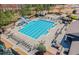 Aerial view of the community pool with slide, lounge chairs, tables, and grilling area at 3413 Fairstone Rd, Wake Forest, NC 27587