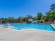 Large community pool with slide and chairs under a clear blue sky at 3413 Fairstone Rd, Wake Forest, NC 27587