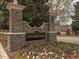 Stonegate entrance sign surrounded by flowers and greenery at 3413 Fairstone Rd, Wake Forest, NC 27587