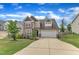 Charming two-story home featuring a spacious driveway and manicured front yard at 3413 Fairstone Rd, Wake Forest, NC 27587