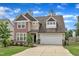 Charming two-story home featuring a spacious driveway and attached garage at 3413 Fairstone Rd, Wake Forest, NC 27587