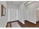 Bright foyer features hardwood floors, white walls, and natural light from the door at 3413 Fairstone Rd, Wake Forest, NC 27587
