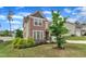Beautifully landscaped front yard with lush green lawn and colorful shrubbery at 3413 Fairstone Rd, Wake Forest, NC 27587