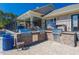Outdoor grilling station featuring three stainless steel grills on a brick base, perfect for entertaining guests at 3413 Fairstone Rd, Wake Forest, NC 27587