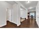 Open-concept living room features hardwood floors and access to the dining room at 3413 Fairstone Rd, Wake Forest, NC 27587
