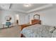 A spacious main bedroom with tray ceilings, two end tables, and a large dresser at 3413 Fairstone Rd, Wake Forest, NC 27587