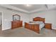 A spacious main bedroom with tray ceilings, two end tables, and a large dresser at 3413 Fairstone Rd, Wake Forest, NC 27587