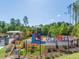 Community playground with a variety of colorful play structures at 3413 Fairstone Rd, Wake Forest, NC 27587