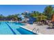 Community pool featuring a waterslide, lounge area, and crystal-clear water at 3413 Fairstone Rd, Wake Forest, NC 27587