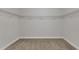 Spacious walk-in closet featuring neutral carpeting and white wire shelving for optimal storage at 3413 Fairstone Rd, Wake Forest, NC 27587