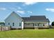 Large backyard with a covered porch, perfect for outdoor relaxation and entertaining at 3417 Aspen Rd, Rocky Mount, NC 27804