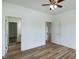 Spacious bedroom offers wood-look floors, a ceiling fan and easy access to other rooms at 3417 Aspen Rd, Rocky Mount, NC 27804