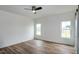 Well-lit bedroom with hardwood floors, neutral walls, and large double windows at 3417 Aspen Rd, Rocky Mount, NC 27804