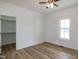 Bright bedroom featuring hardwood floors, a ceiling fan and a closet for ample storage at 3417 Aspen Rd, Rocky Mount, NC 27804