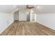 Bright bonus room with vaulted ceilings, hardwood floors, and multiple closets at 3417 Aspen Rd, Rocky Mount, NC 27804
