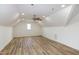 Spacious bonus room with hardwood floors, vaulted ceilings, and natural light from the window at 3417 Aspen Rd, Rocky Mount, NC 27804