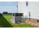 Exterior view showing the home's AC unit, landscaping, and fence at 3417 Aspen Rd, Rocky Mount, NC 27804