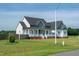 Charming two-story house with a inviting front porch, set on a well-manicured lawn at 3417 Aspen Rd, Rocky Mount, NC 27804