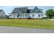 Beautiful two story home featuring a large front porch and well maintained landscaping at 3417 Aspen Rd, Rocky Mount, NC 27804