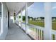 Inviting front porch with white columns, offering a relaxing outdoor space at 3417 Aspen Rd, Rocky Mount, NC 27804