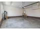 Spacious two car garage with access door and bare concrete floors and block base at 3417 Aspen Rd, Rocky Mount, NC 27804