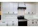 Modern kitchen with white cabinets, quartz countertops, and stainless steel appliances at 3417 Aspen Rd, Rocky Mount, NC 27804
