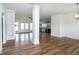 Open-concept living room with hardwood floors and access to the kitchen at 3417 Aspen Rd, Rocky Mount, NC 27804