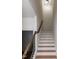 Staircase with wood and white trim, and hardwood steps featuring a classic design at 3417 Aspen Rd, Rocky Mount, NC 27804