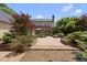 Scenic backyard features a brick patio bordered by lush greenery, ideal for outdoor living at 4109 City Of Oaks Wynd, Raleigh, NC 27612