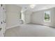 Bedroom with neutral walls, carpet flooring, built in bench, and natural light at 4109 City Of Oaks Wynd, Raleigh, NC 27612