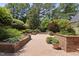 Expansive brick patio with surrounding landscaping, ideal for relaxing and outdoor gatherings at 4109 City Of Oaks Wynd, Raleigh, NC 27612