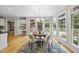 Charming dining area features a round table, a stylish rug, and views of backyard at 4109 City Of Oaks Wynd, Raleigh, NC 27612