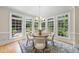 Cozy dining area with ample natural light, a round table, and stylish decor at 4109 City Of Oaks Wynd, Raleigh, NC 27612