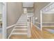 Bright foyer features hardwood floors, staircase, and an open gallery, creating a welcoming entrance at 4109 City Of Oaks Wynd, Raleigh, NC 27612