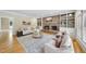 Inviting living room features hardwood floors, brick fireplace, and built-in shelves for cozy relaxation at 4109 City Of Oaks Wynd, Raleigh, NC 27612