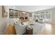 Comfortable living room with a brick fireplace, built-in shelving, and abundant natural light at 4109 City Of Oaks Wynd, Raleigh, NC 27612